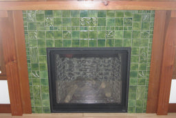 Crafting Nature: A Hearth with Green Handmade Tiles and Natural Woodwork