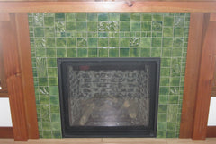 Crafting Nature: A Hearth with Green Handmade Tiles and Natural Woodwork