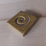 spiral 2"x2" Ceramic Handmade Tile - honey edge view