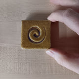 spiral 2"x2" Ceramic Handmade Tile - honey size reference